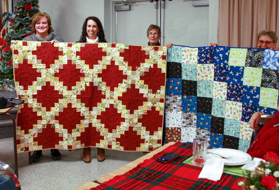 Grand Quilt Guild donates 55 quilts to Adopt-a-Family program post image