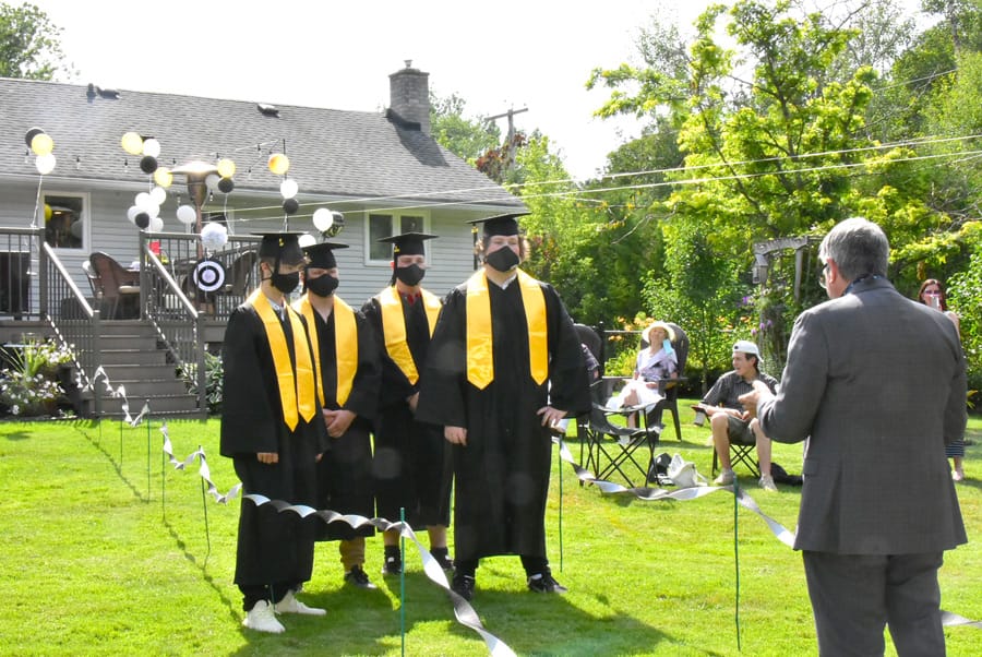 Family holds backyard graduation ceremony post image