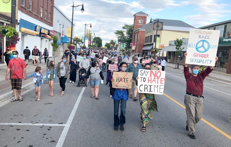 Minto residents march against hate post image