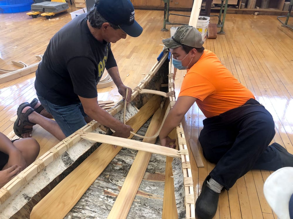 Local Indigenous students participate in traditional birch bark canoe build post image