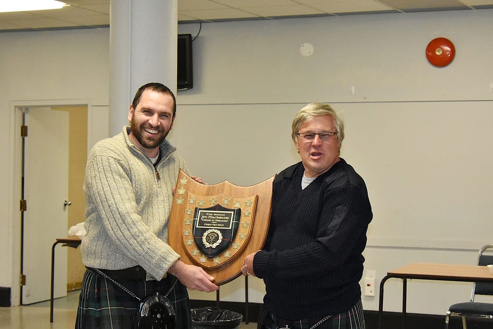 Fergus Pipe Band awards Shawn Aitken with James MacKenzie award post image
