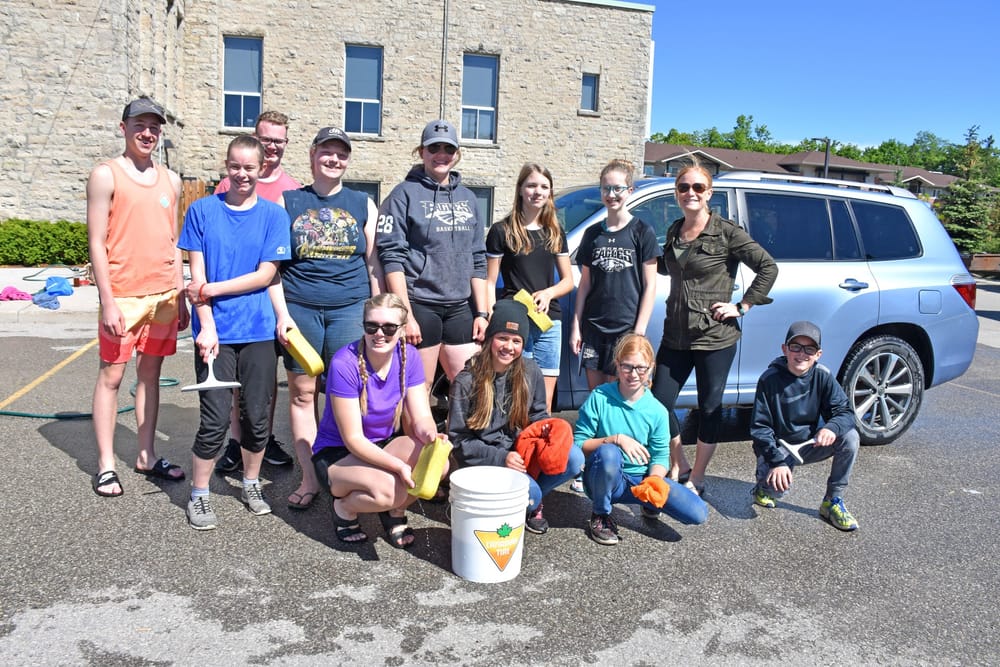 Emmanuel Christian High School hosted a car wash in support of Groves Hospital post image