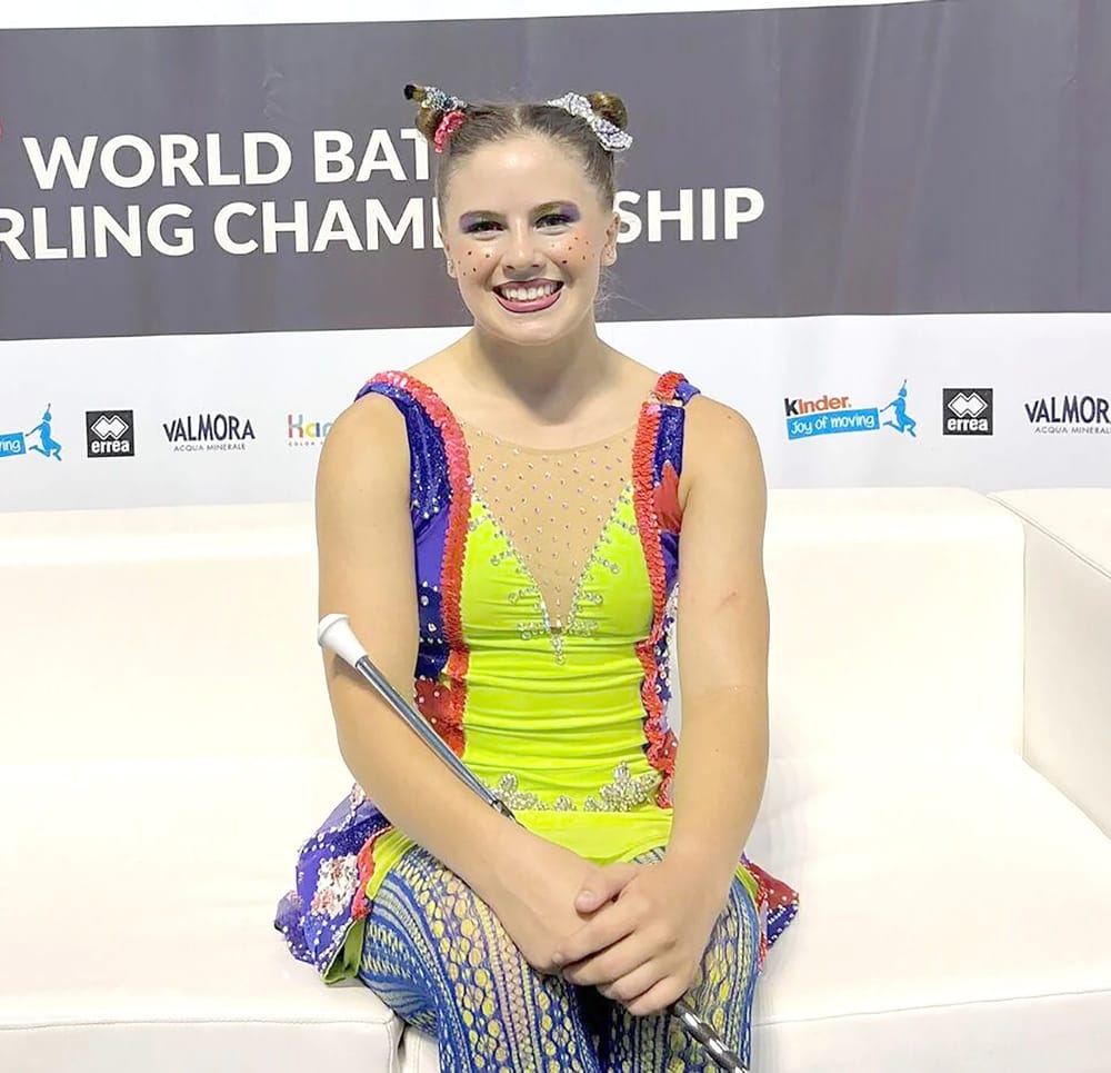 Student baton twirler graduates with scholarship post image