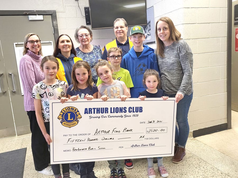 Lions Club presents a $1,500 donation to the Arthur Food Bank post image