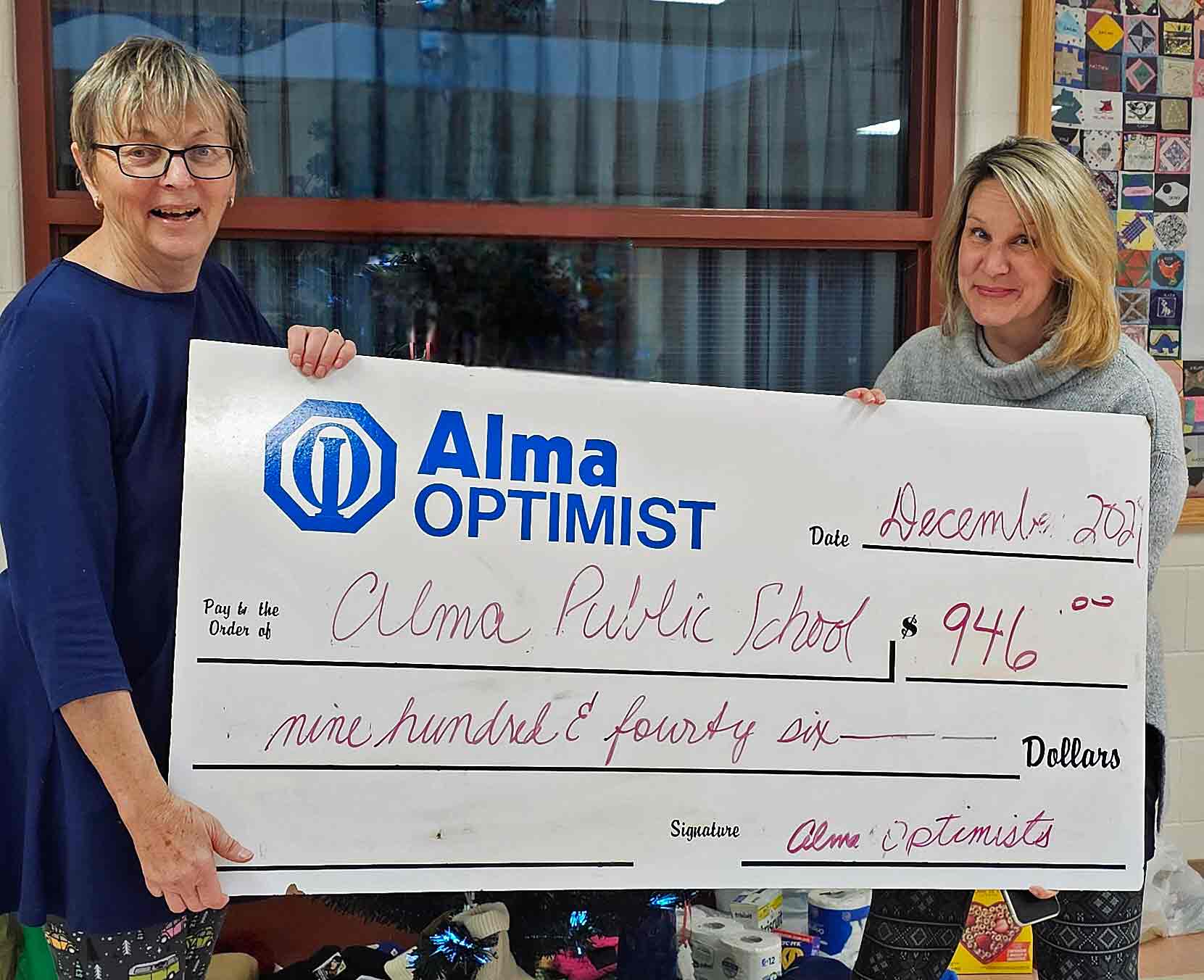 Alma Optimist Club donates $900 to Alma Public School post image