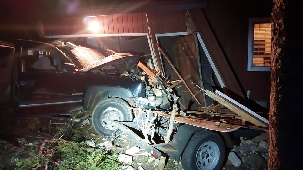 Police seek suspect after stolen truck crashes into home post image