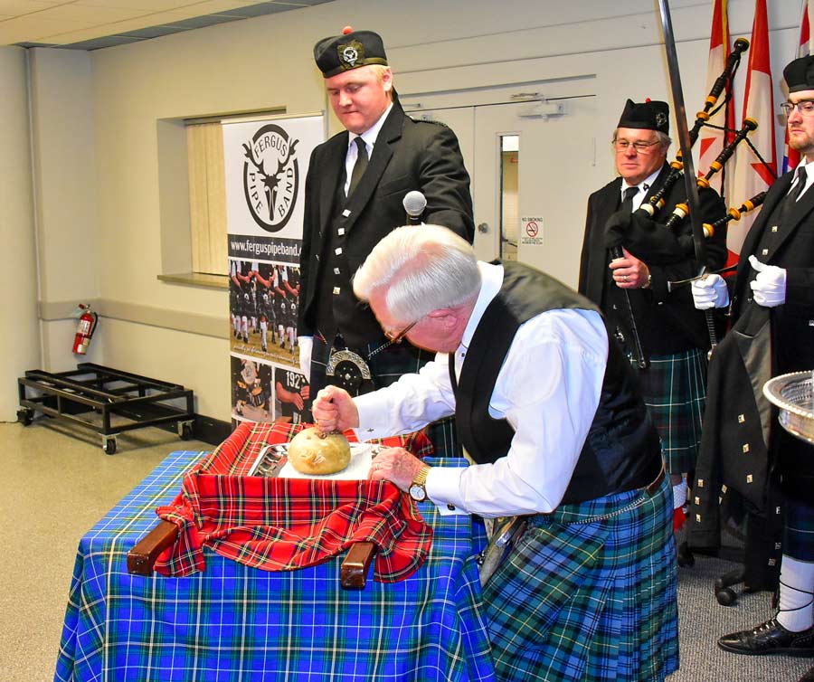 Addressing the haggis at Robbie Burns event