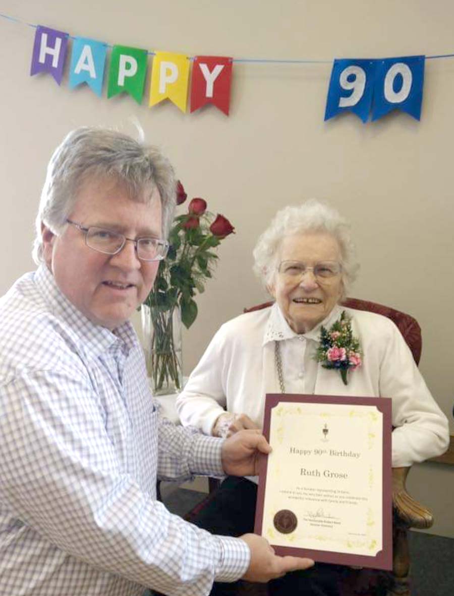 Senator Rob Black helps celebrate a major milestone for Ruth Grose