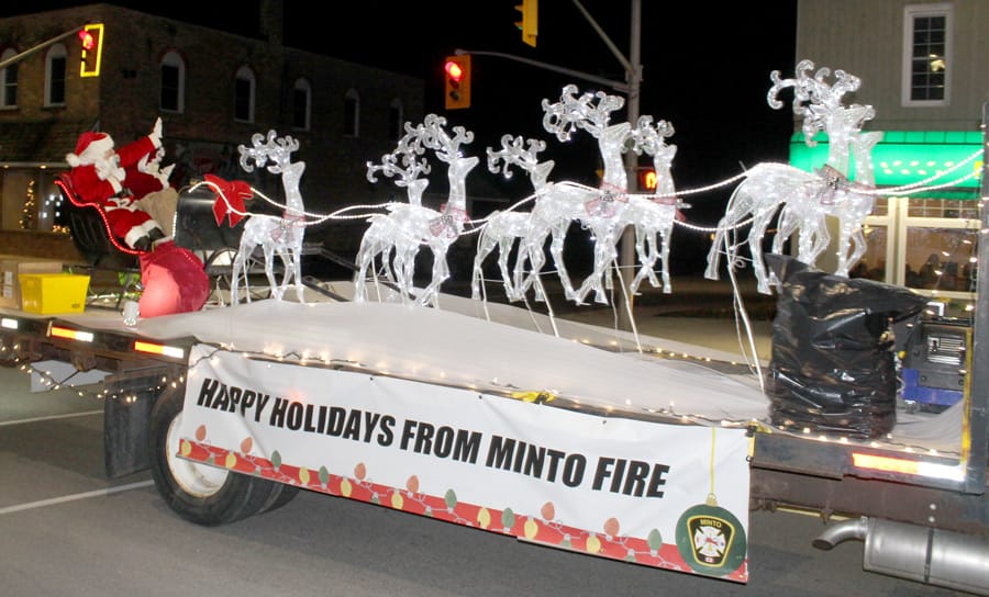Santa parades through streets of Clifford