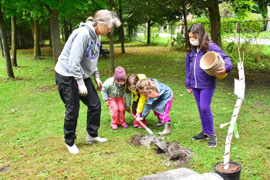 Students help plant trees at Elora Centre for the Arts