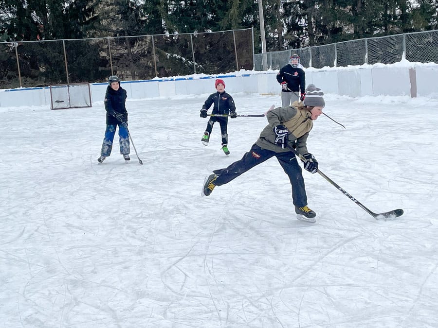 Pick-up hockey action at the Alma Optimist Club ice rink
