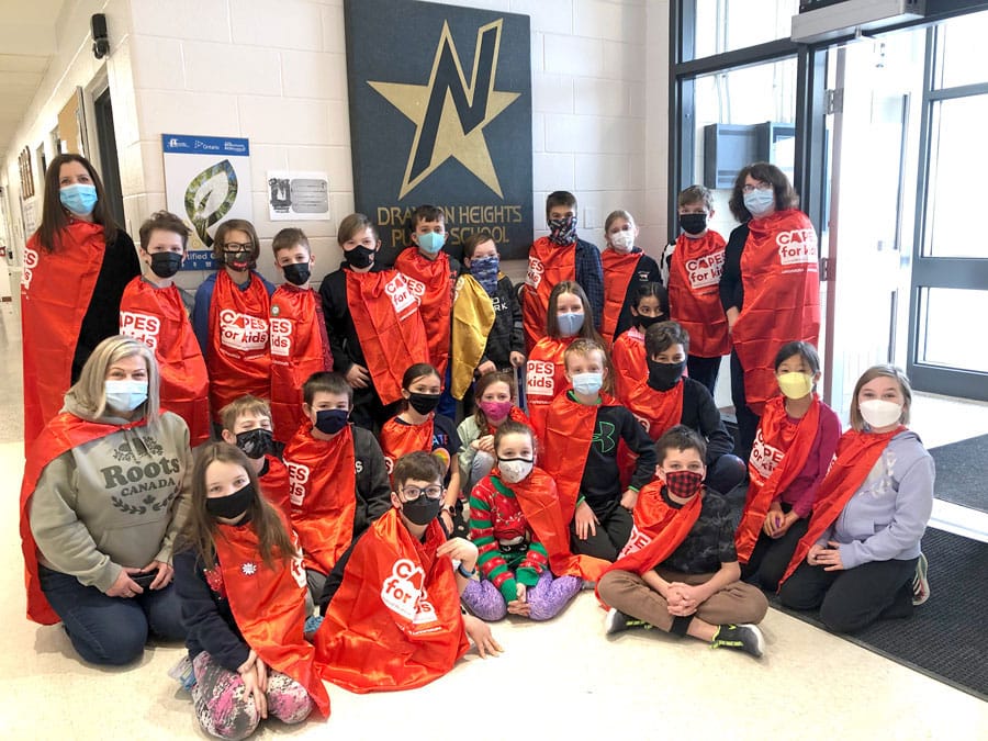 Classmates don capes in support of children’s hospital campaign