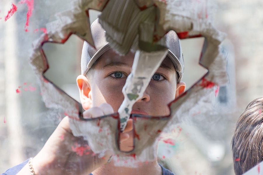 Arthur School of Art teams up with local students to paint village red, white