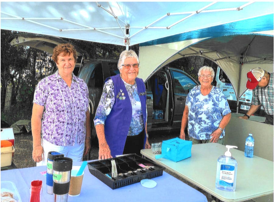 LMH Auxiliary members staff food booth at farmers market