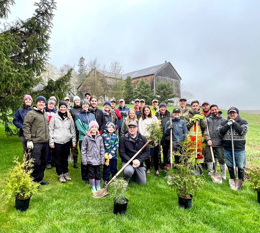 Friends of the Grand plant trees along Carroll Creek
