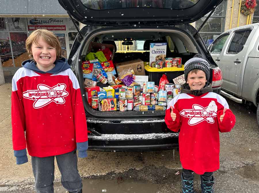 Centre Wellington Fusion hockey players donate to local Food Bank