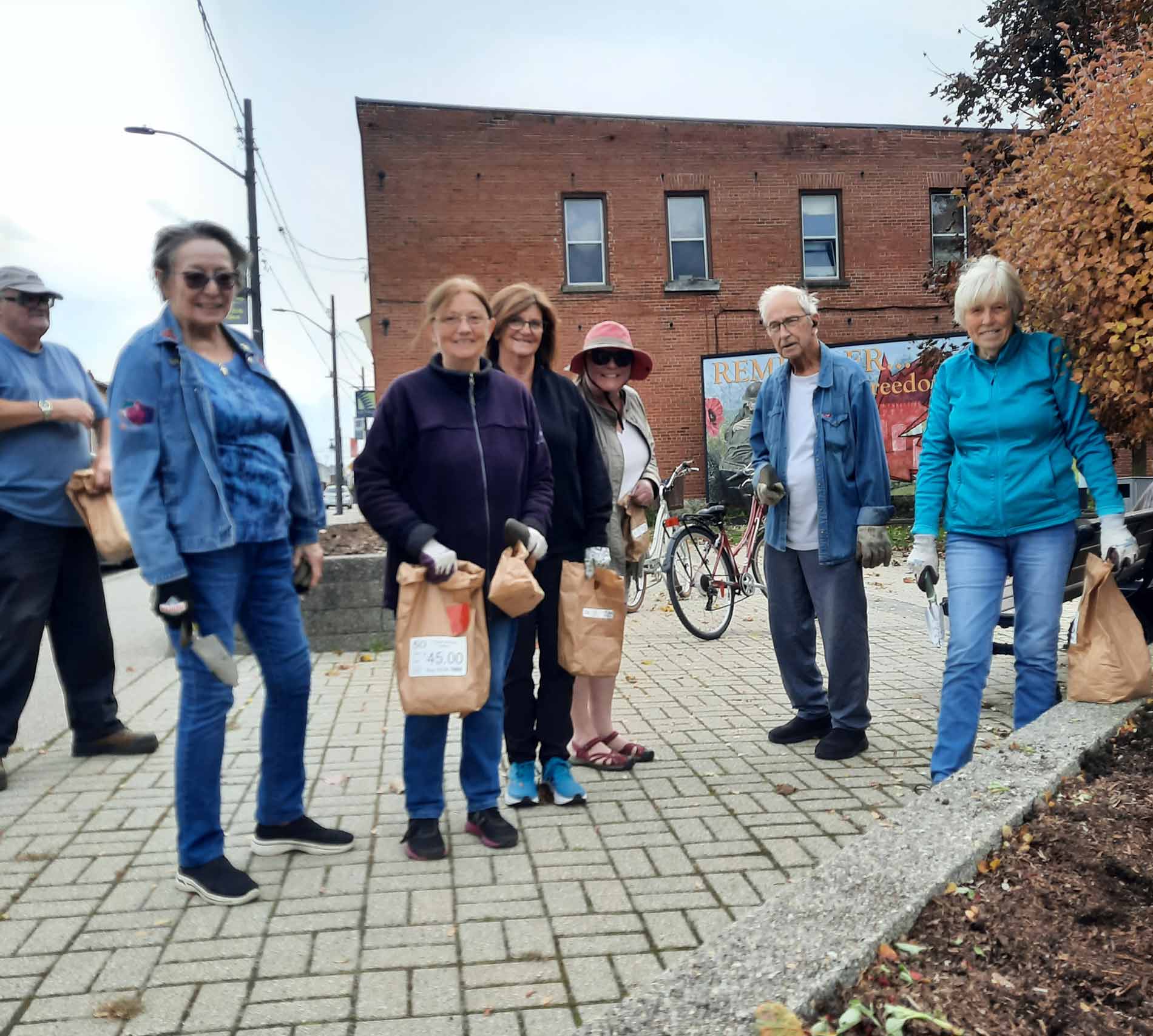 Arthur Horticultural Society members plant tulips for Arthur cenotaph