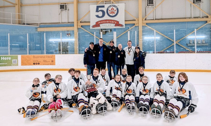 Woolwich Thrashers Junior sledge hockey team celebrate first-ever league championship