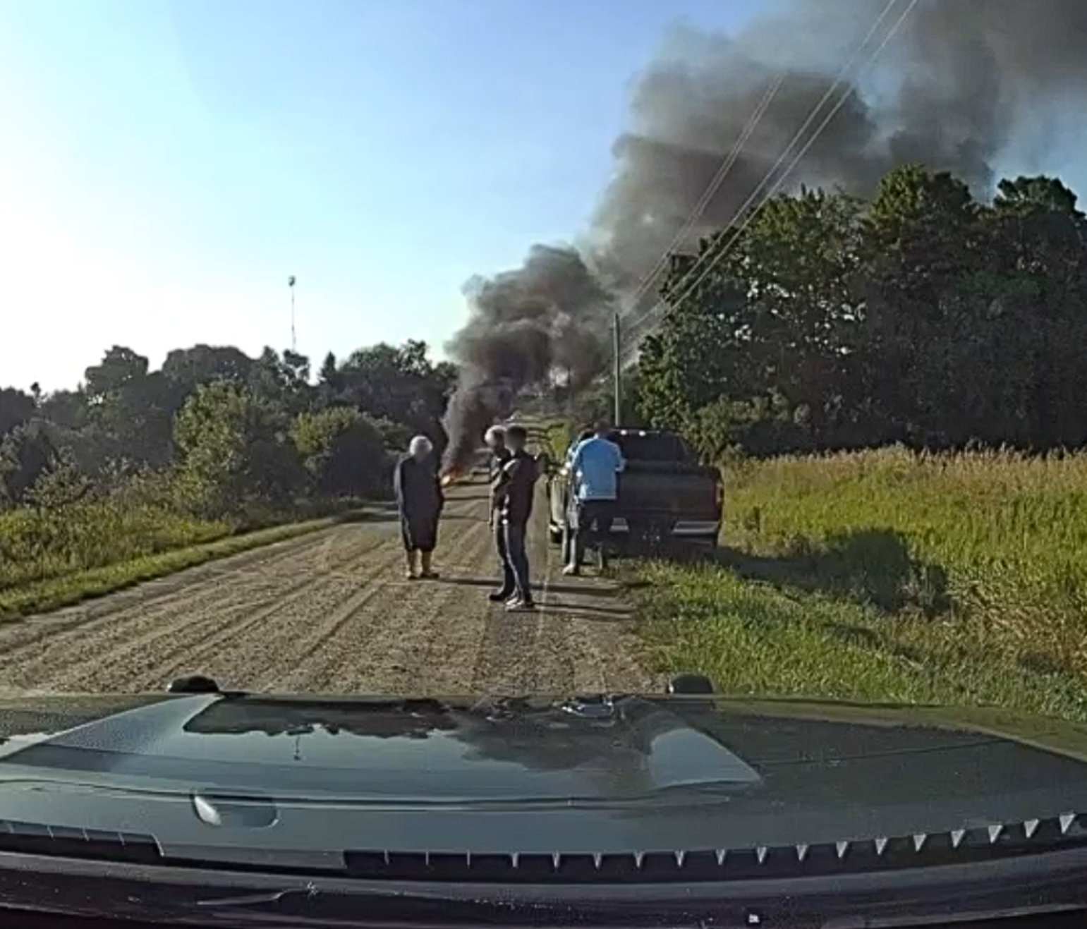 Two charged after vehicle crashes into ditch, catches fire