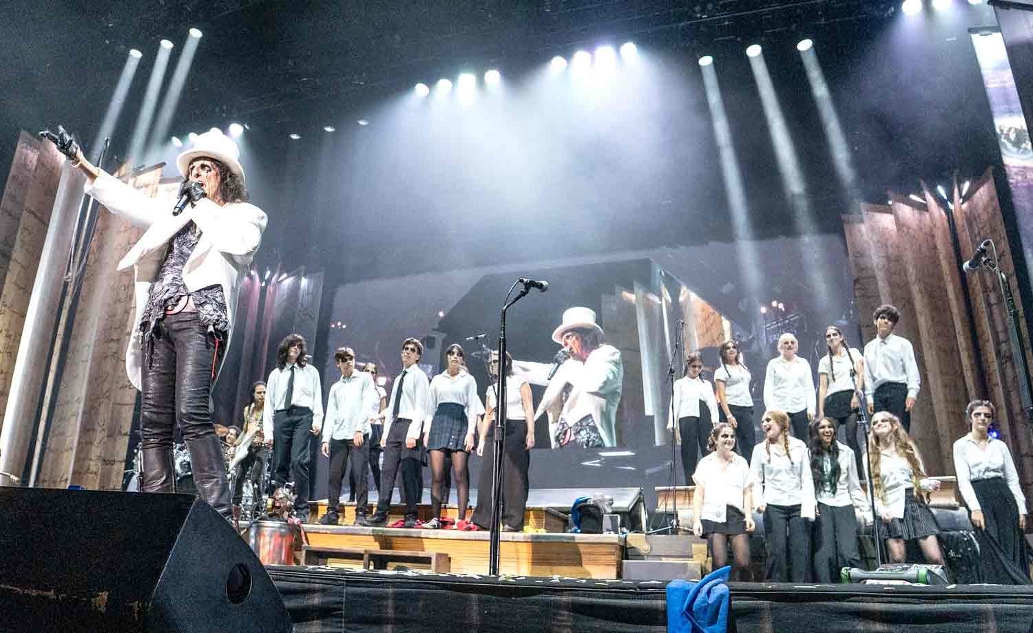 Local high school students perform on stage with Alice Cooper