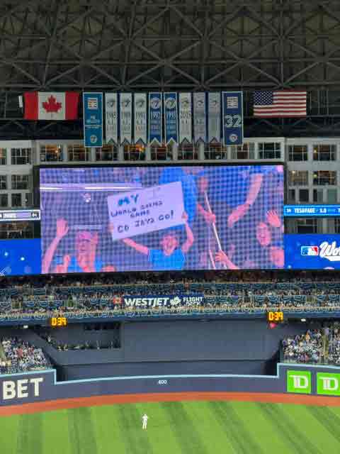 Cheering from the big screen at World Series game